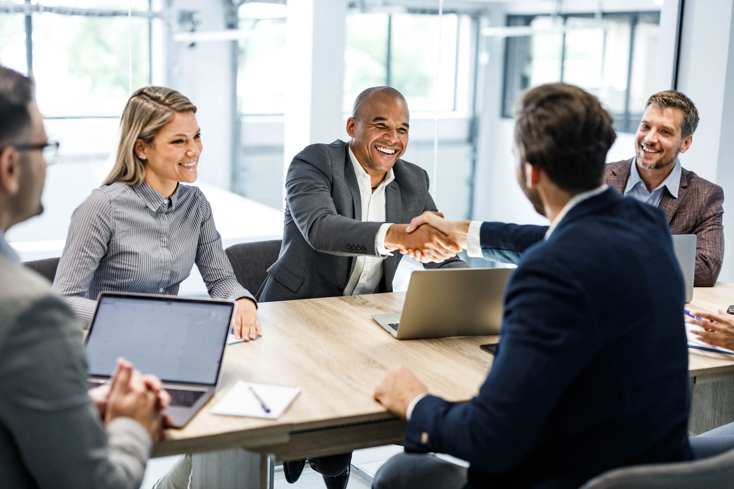 Business partners reaching agreement during a commercial real estate meeting