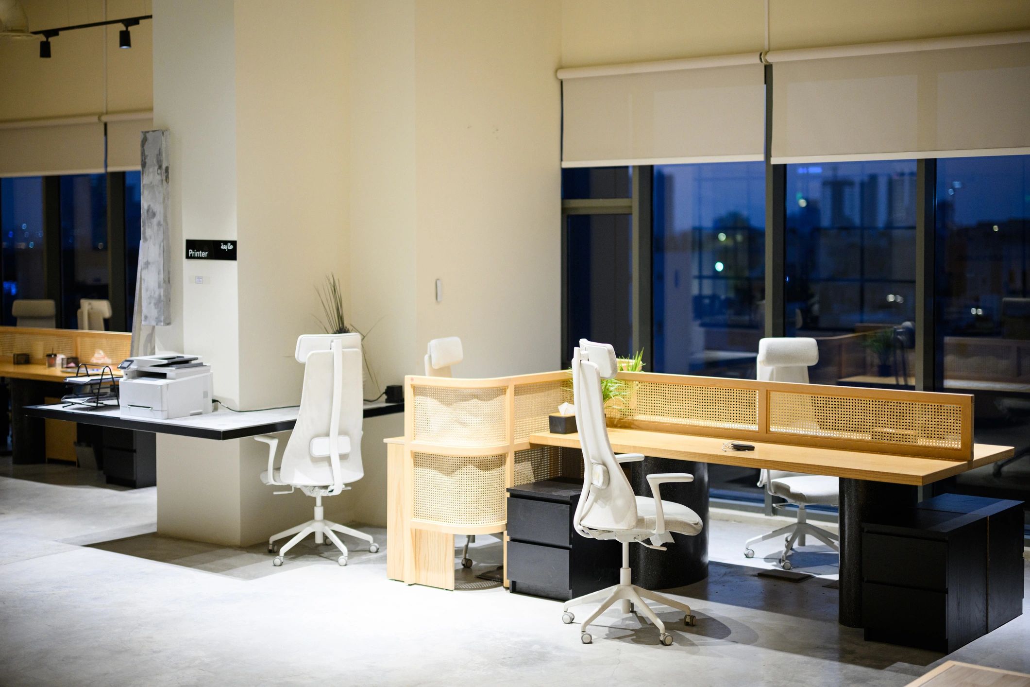 Modern office interior with desks and city view