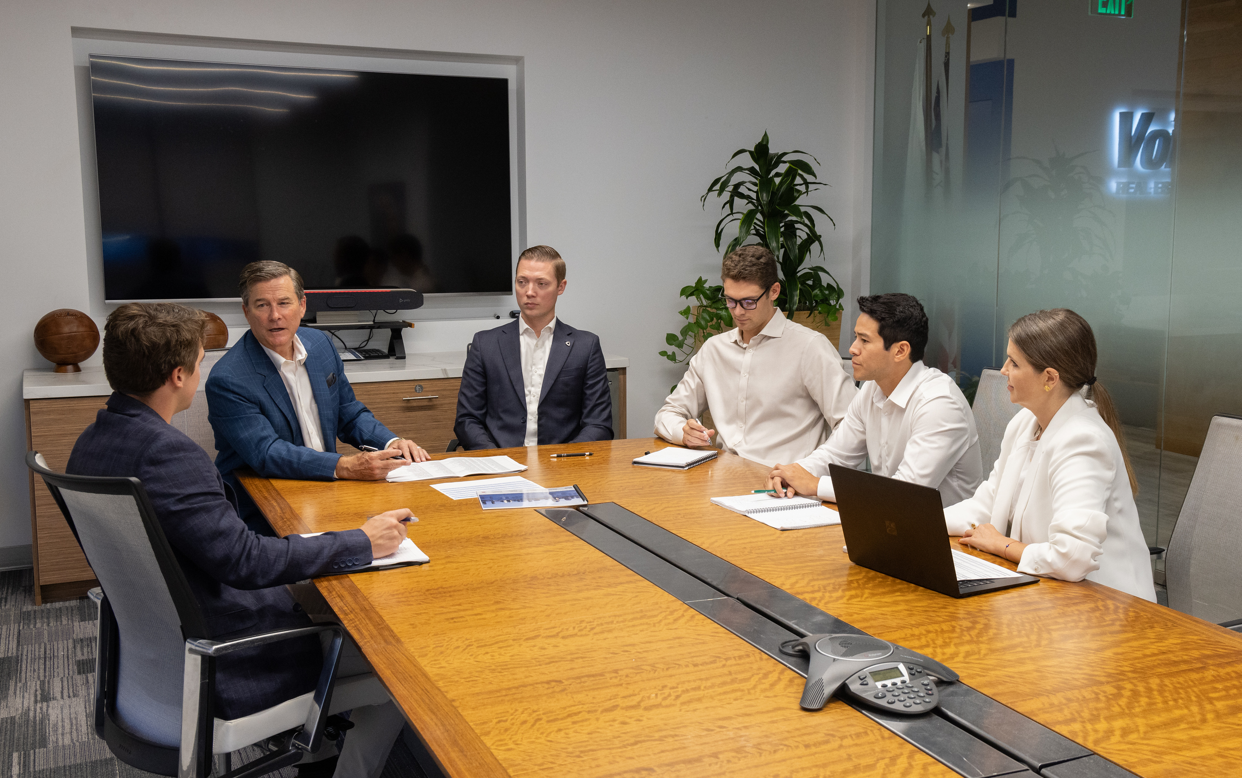 Mulvaney Commercial Advisors team meeting in conference room